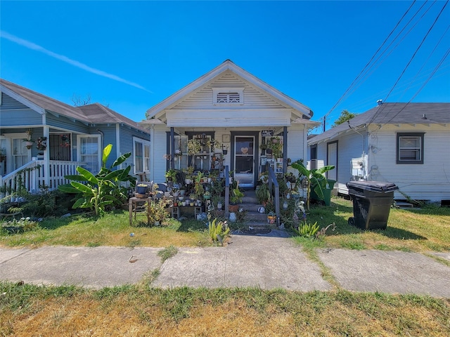 shotgun-style home with covered porch