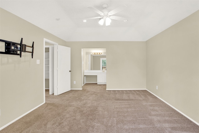 carpeted spare room featuring recessed lighting, baseboards, a ceiling fan, and vaulted ceiling