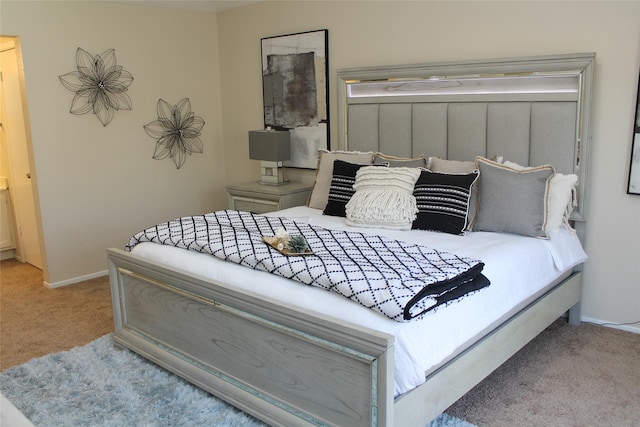 bedroom featuring carpet flooring and baseboards