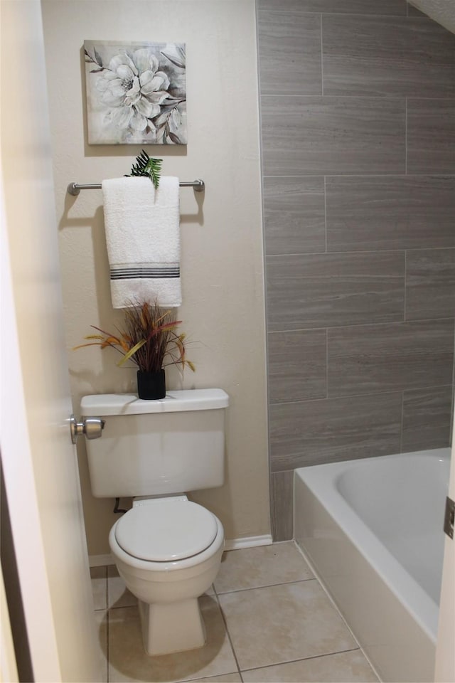 full bathroom featuring tile patterned flooring, baseboards, a washtub, toilet, and a shower