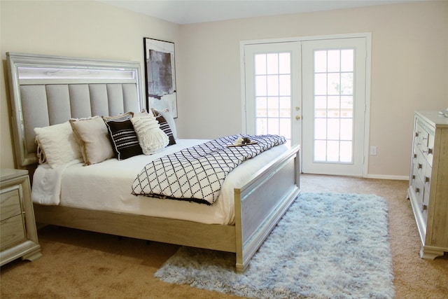 bedroom featuring access to exterior, french doors, light carpet, and baseboards