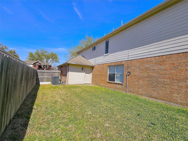 view of yard featuring central air condition unit and a fenced backyard