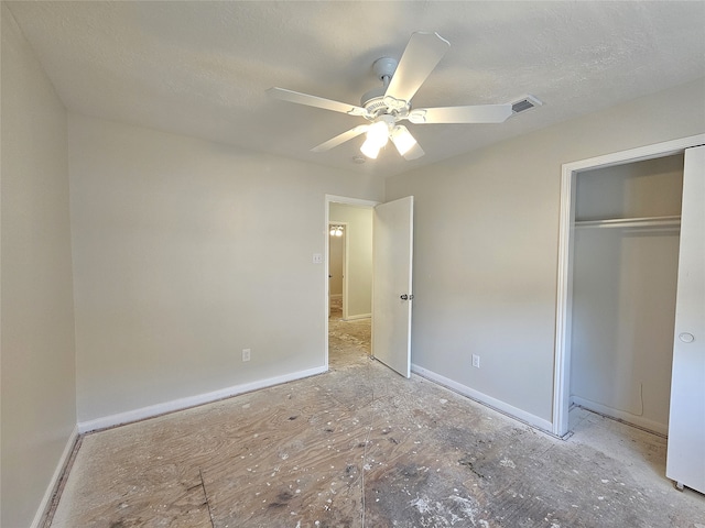 unfurnished bedroom featuring baseboards, visible vents, ceiling fan, a closet, and a textured ceiling