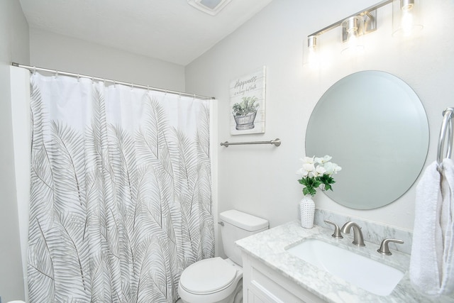 full bathroom featuring toilet and vanity