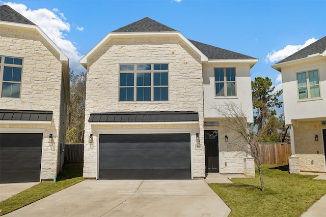 view of front of property with concrete driveway, an attached garage, fence, and stone siding