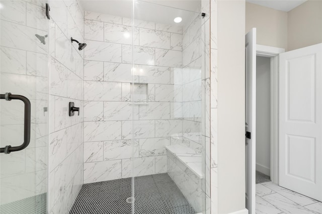 full bath featuring a shower stall and marble finish floor