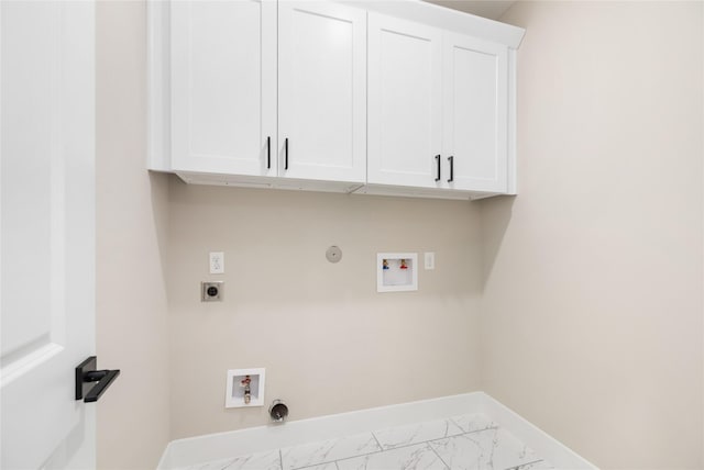 washroom featuring washer hookup, baseboards, marble finish floor, and electric dryer hookup