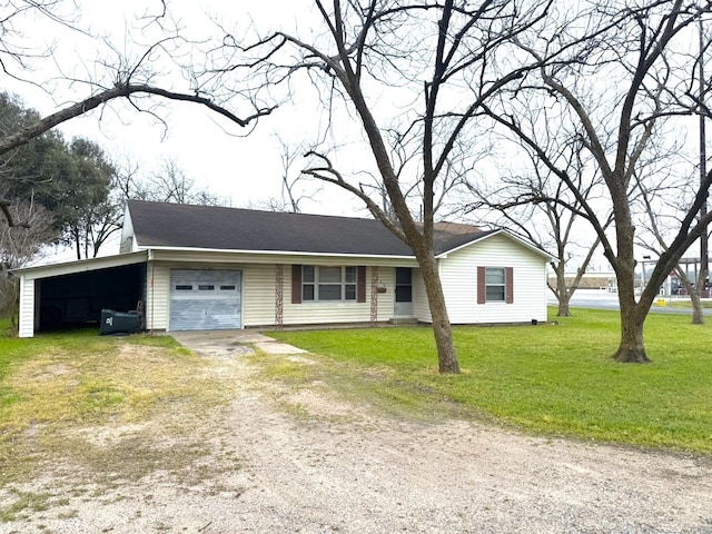 view of front of home featuring a front lawn, an attached garage, a carport, and dirt driveway