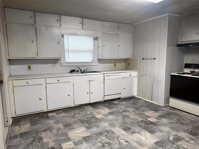 kitchen with electric range, light countertops, white cabinets, dishwasher, and exhaust hood