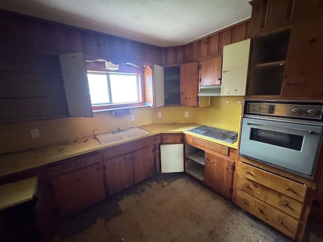 kitchen featuring a sink, black electric stovetop, light countertops, white oven, and open shelves