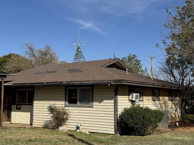 view of property exterior featuring roof with shingles