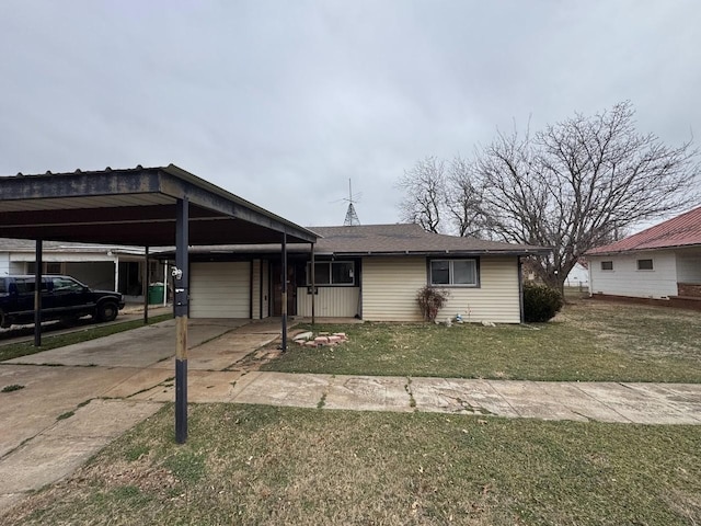 view of front of home with a front lawn, an attached garage, a carport, and concrete driveway