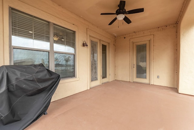 view of patio with area for grilling and ceiling fan