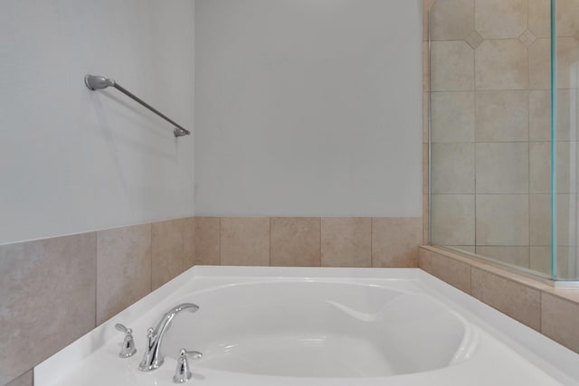 full bathroom featuring a garden tub