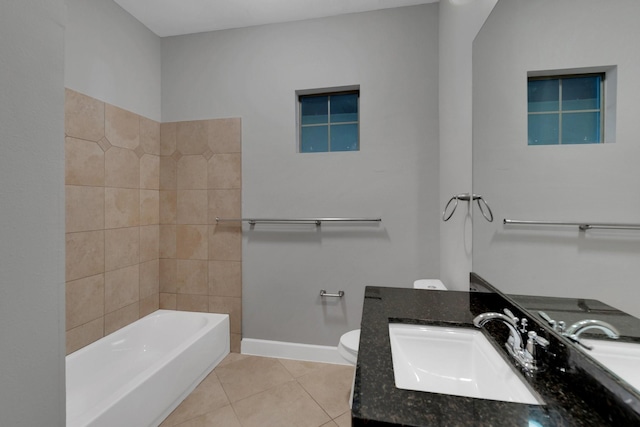 bathroom with vanity, a bath, baseboards, tile patterned floors, and toilet