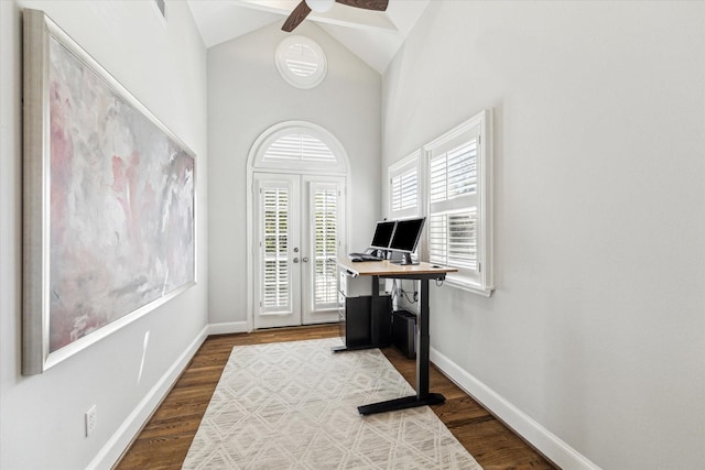 office space featuring baseboards, lofted ceiling, ceiling fan, and dark wood-style flooring