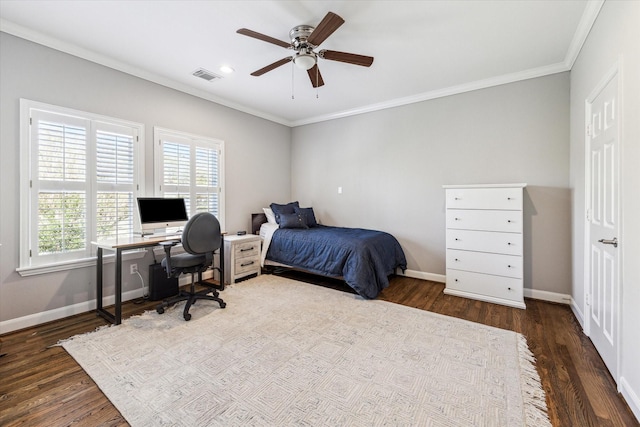 bedroom with wood finished floors, baseboards, visible vents, ceiling fan, and ornamental molding