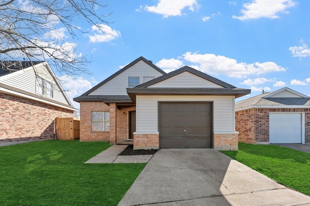 view of front of property featuring brick siding, a garage, driveway, and a front lawn