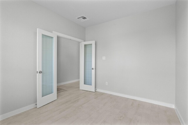 357 Spruce Oak Ln, Waller, TX 77484 - unfurnished room with french doors, baseboards, and wood finished floors