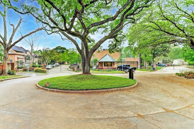 view of property's community featuring a lawn