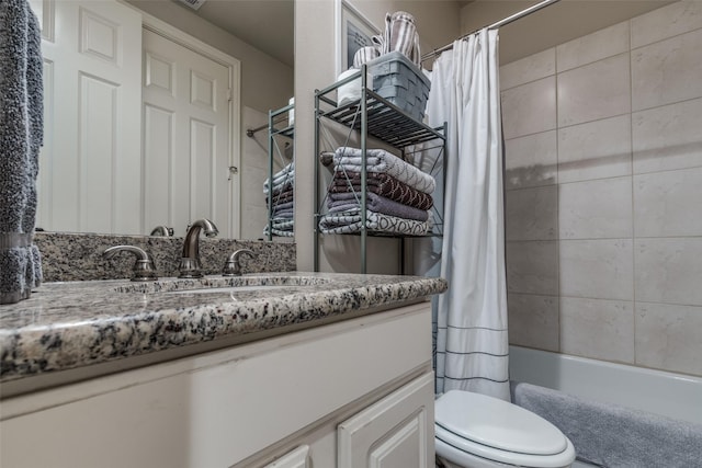 bathroom featuring shower / bathtub combination with curtain, toilet, and vanity