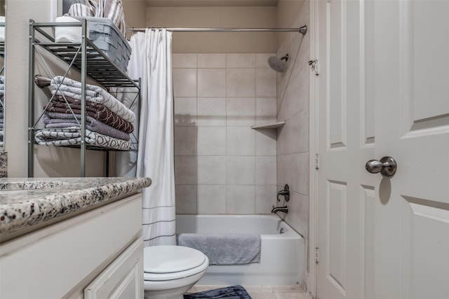 bathroom featuring shower / bathtub combination with curtain, toilet, vanity, and tile patterned flooring