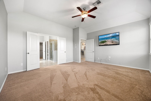 unfurnished bedroom featuring vaulted ceiling, baseboards, visible vents, and carpet floors