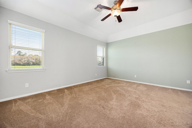 unfurnished room featuring visible vents, ceiling fan, baseboards, and carpet