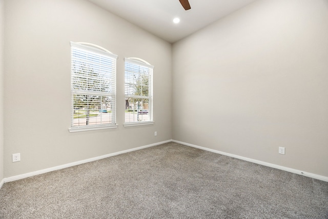 carpeted spare room with recessed lighting, baseboards, and ceiling fan