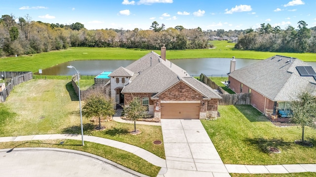 bird's eye view with a water view