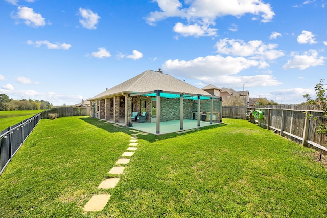 view of yard featuring a patio and a fenced backyard