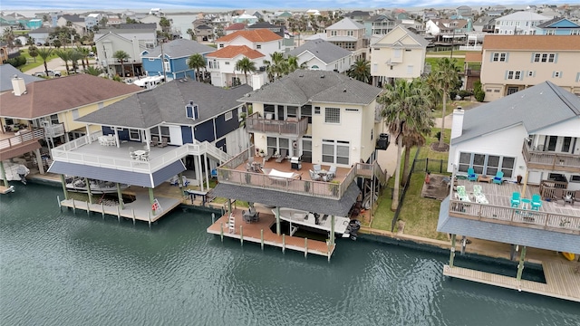 aerial view with a residential view and a water view