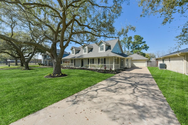 view of front of house featuring a shingled roof, a front lawn, a porch, a garage, and driveway