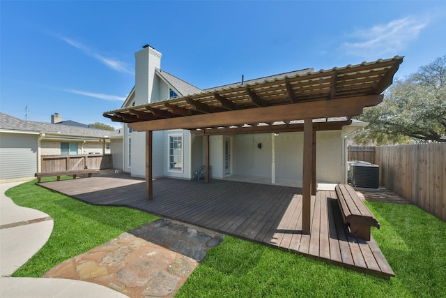 rear view of property featuring central AC, a yard, a fenced backyard, a deck, and a pergola