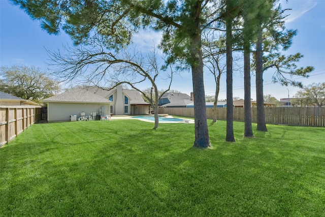 view of yard with a fenced in pool and a fenced backyard