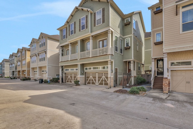 townhome / multi-family property featuring a garage and a residential view