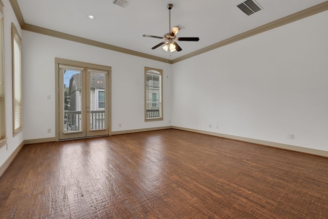 empty room featuring a ceiling fan, crown molding, baseboards, and visible vents