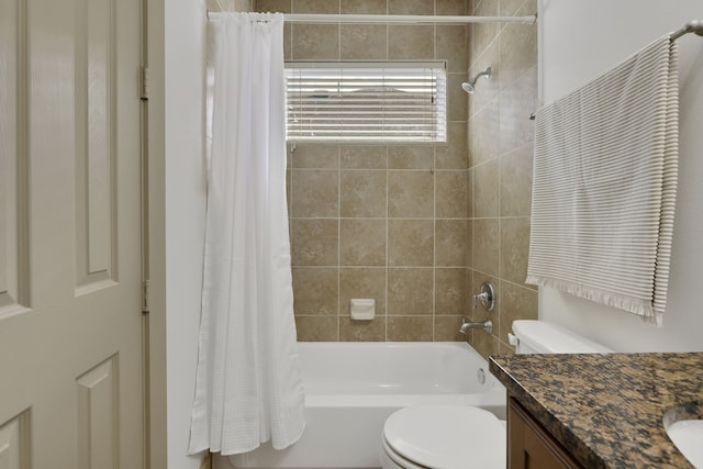 bathroom featuring toilet, vanity, and shower / bath combo