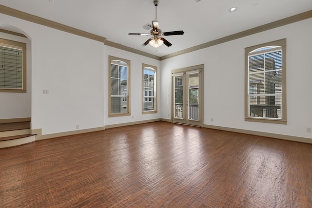 unfurnished room with a ceiling fan, baseboards, and wood finished floors