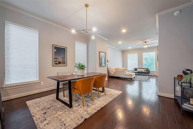 dining area with baseboards, dark wood finished floors, and crown molding