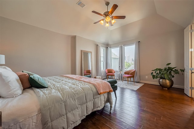 bedroom featuring visible vents, dark wood-type flooring, ceiling fan, baseboards, and vaulted ceiling