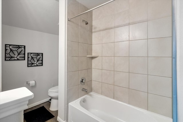 full bath with shower / bathing tub combination, baseboards, and toilet