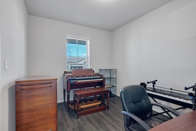 home office featuring baseboards and wood finished floors