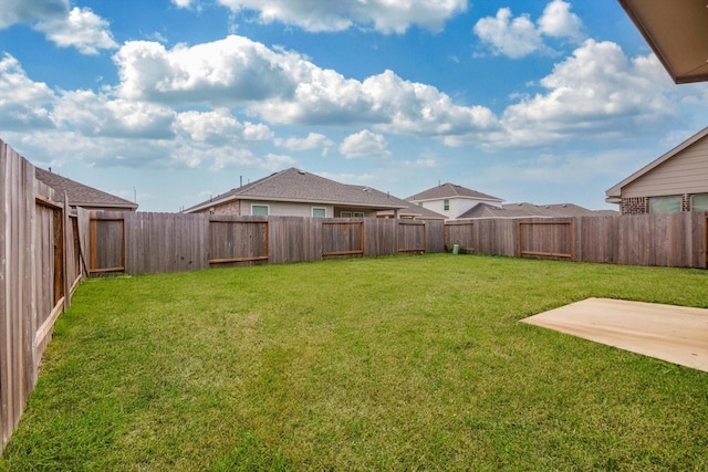 view of yard featuring a patio and a fenced backyard