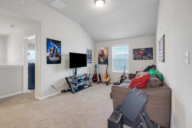 interior space with vaulted ceiling, baseboards, visible vents, and carpet floors