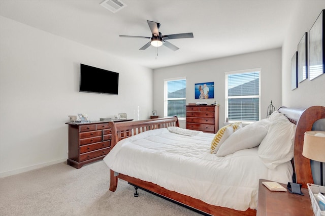 bedroom with a ceiling fan, carpet flooring, baseboards, and visible vents