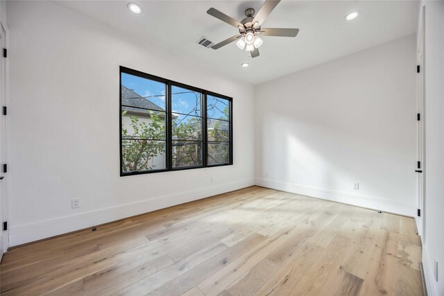 empty room featuring visible vents, recessed lighting, baseboards, and light wood-style floors