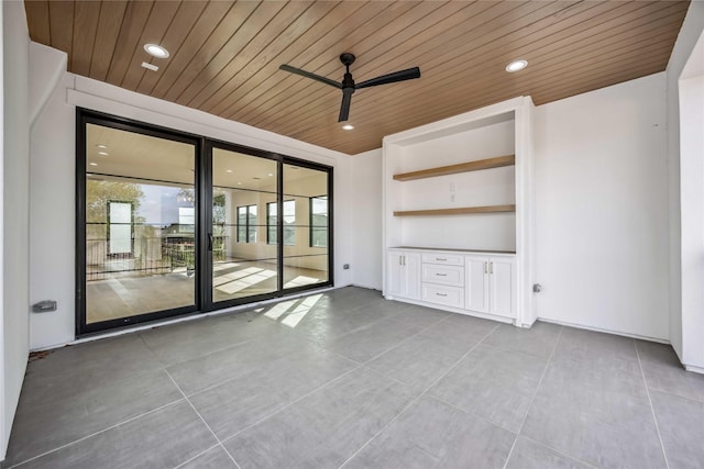 spare room with recessed lighting, wood ceiling, and a ceiling fan