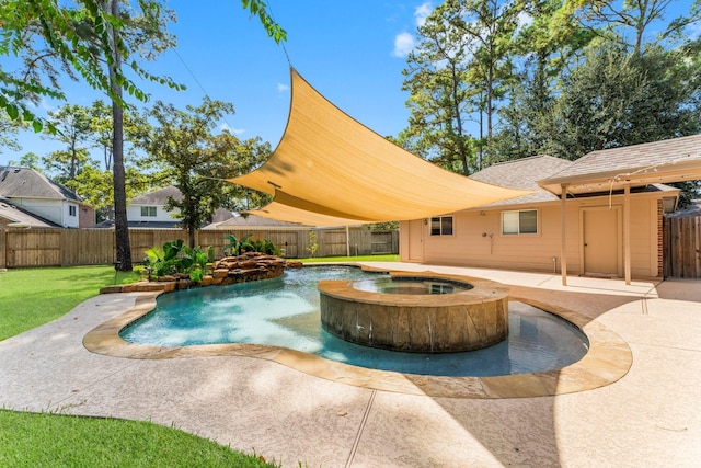 view of pool featuring a patio area, a yard, an in ground hot tub, and a fenced backyard