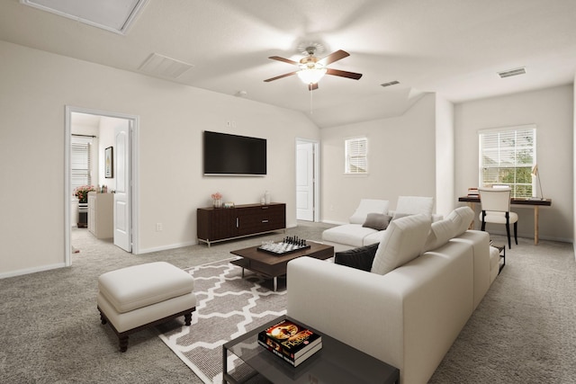 carpeted living room with visible vents, baseboards, and ceiling fan